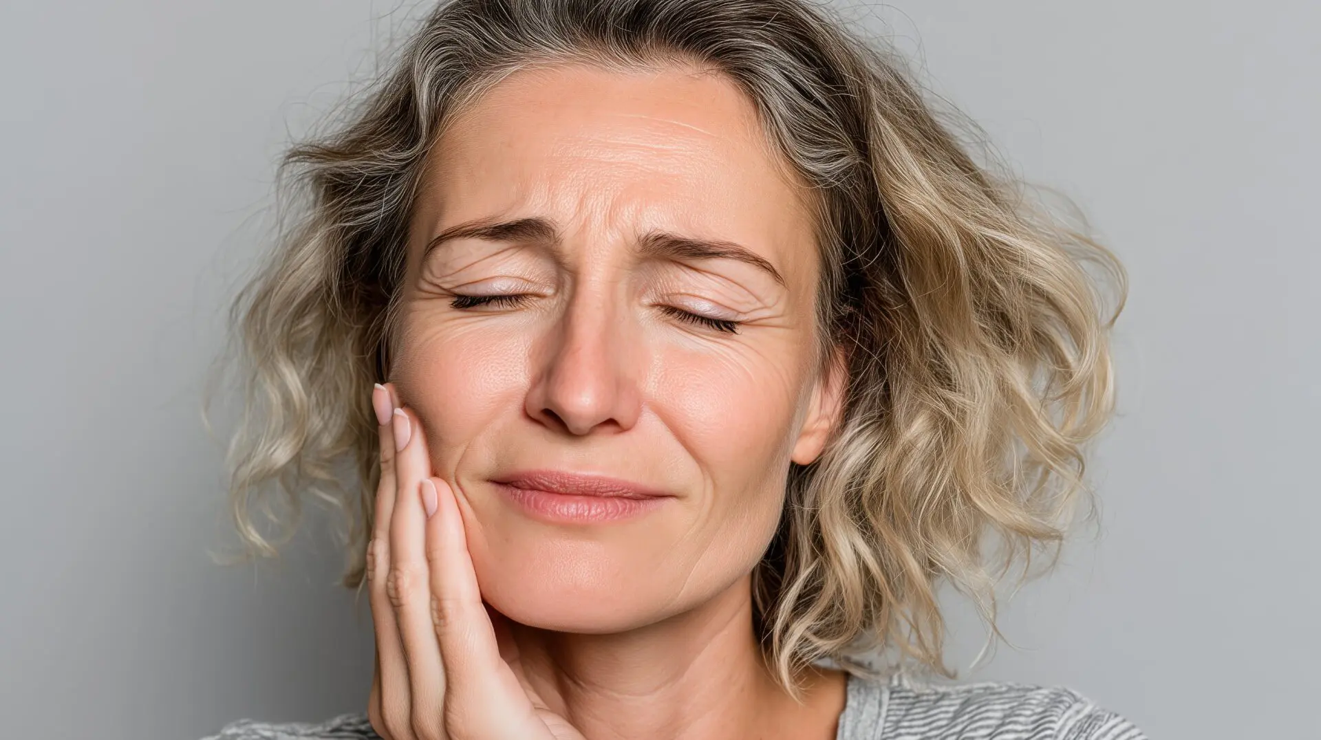 Woman experiencing stress and tooth pain discomfort