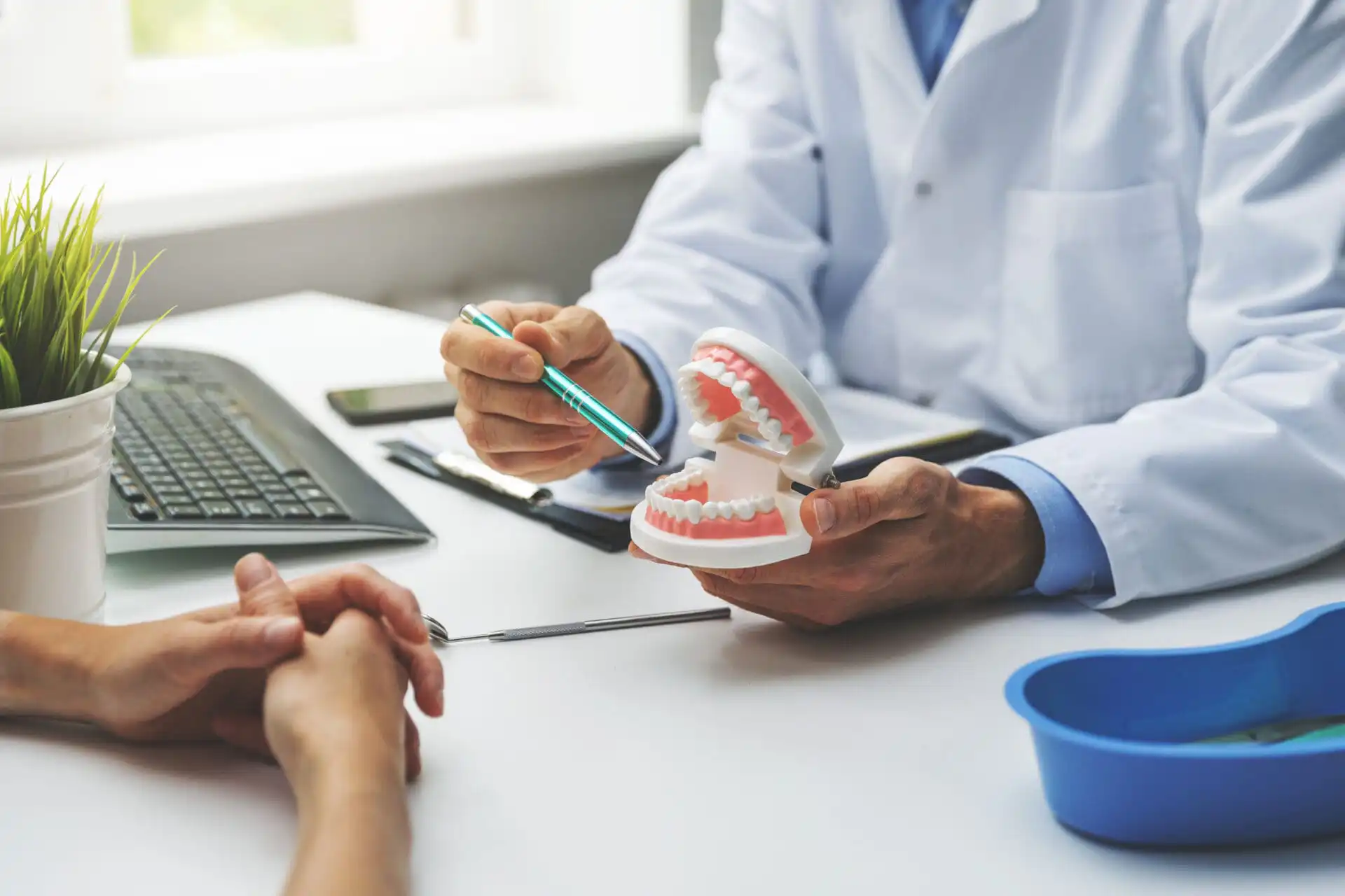 dentist and patient discussion about how to treat white spot lesions on teeth